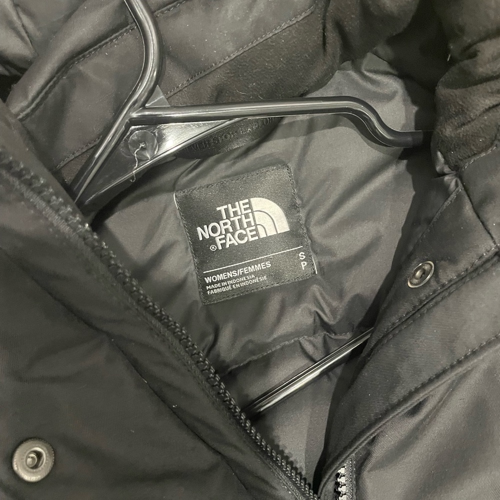 Black North Face woman’s winter coat